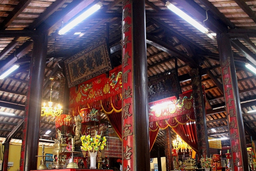 Admiring two century-old communal house in Mekong Delta
