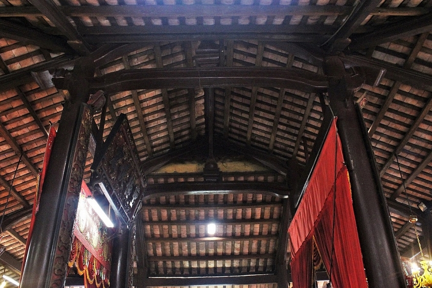 Admiring two century-old communal house in Mekong Delta