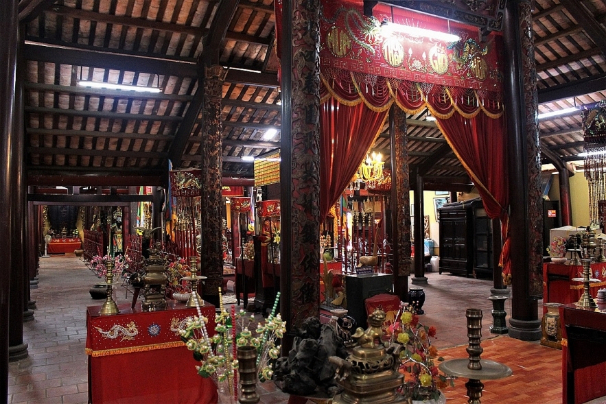 Admiring two century-old communal house in Mekong Delta