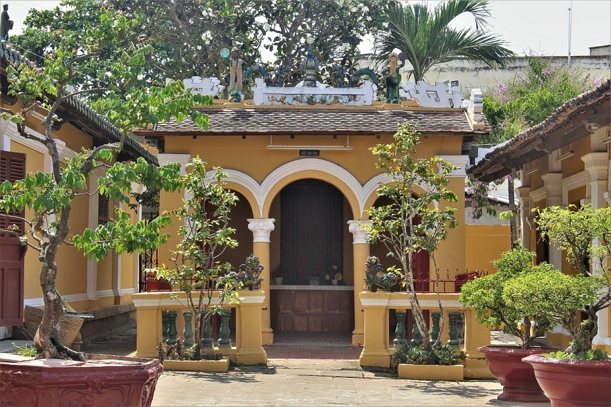 Admiring two century-old communal house in Mekong Delta
