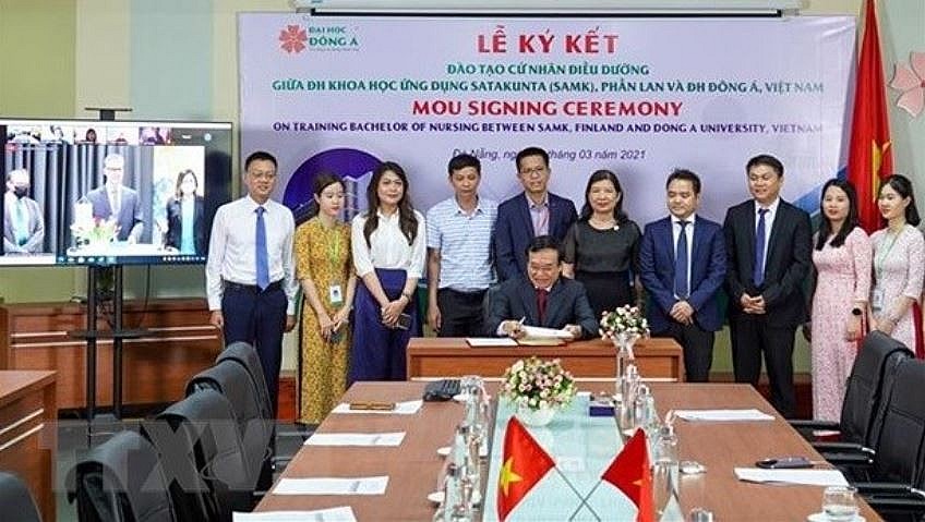 At a signing ceremony between Vietnamese and Finnish universities. Photo: VNA.