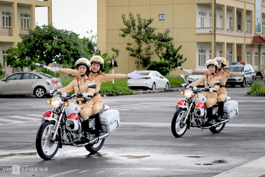 Vietnamese traffic police women exercise to lead groups of delegation by powerful motorcycles.