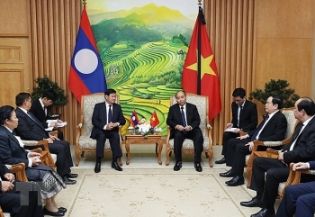 vietnamese and lao governments determine to foster comprehensive cooperation