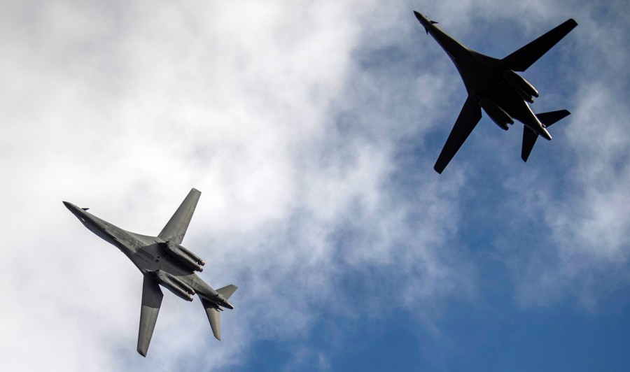 china deploys 2 aircraft carriers while the uss two air force b 1b lancer bombers flying over the east sea
