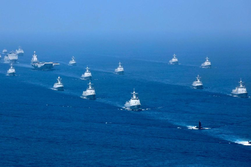 china deploys 2 aircraft carriers while the uss two air force b 1b lancer bombers flying over the east sea