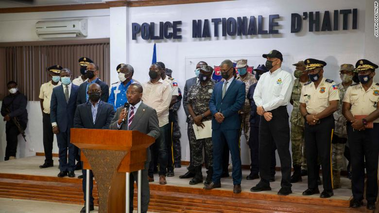 Interim President Claude Joseph, center, speaks to journalists during a press conference in Port-au-Prince, Haiti, on July 8