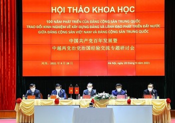 Vietnam, China Exchanges Experience in Party Building and National Development