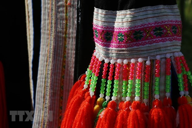 Unique decorative motifs and jewelry on the costumes of Red Dao women. Photo: VNA