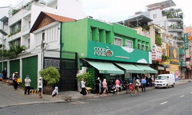Shoppers lined up outside a supermarket in Binh Thanh district, HCM City, on July 14. Photo: VNA
