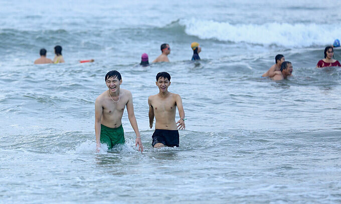 People swim at a beach in Da Nang City, July 10, 2021. Photo: VnExpress