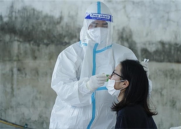 Collecting a sample for Covid-19 testing in Dien Bien province. Photo: VNA