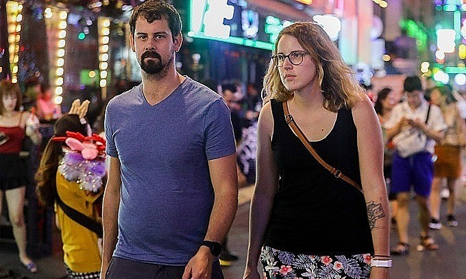 Foreigners walk on Bui Vien pedestrian street in HCMC, 2019. Photo: VnExpress