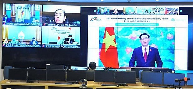 NA Chairman Vuong Dinh Hue speaks at the event. Photo: VNA