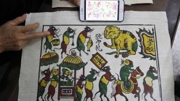 "Rat’s Weddings" galore as Vietnamese woodcut artist prepares for Tet