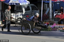touching chinese 64 yr old man taking care of his 80 yr old mom