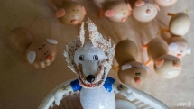 vietnam craftsman making world cup mascots from eggshells