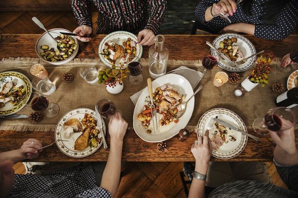 Group of people eating thanksgiving dinner